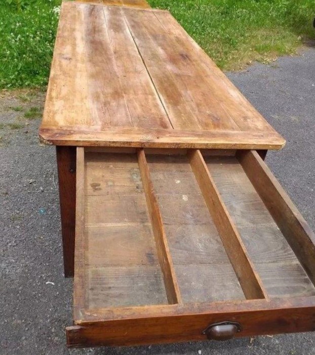 French Table in cherrywood . Table top has cleated ends and a very large Bread slide in one end and a very large drawer in the other end. Town and Country Antiques