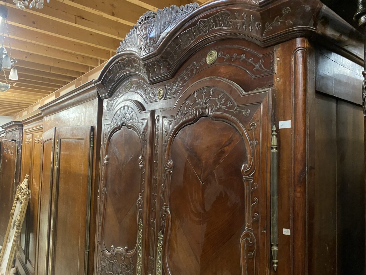French Rennes Cherrywood Armoire. Beautiful Floral and Vine decoration with original brass escutcheons and side panels. Dated 1838