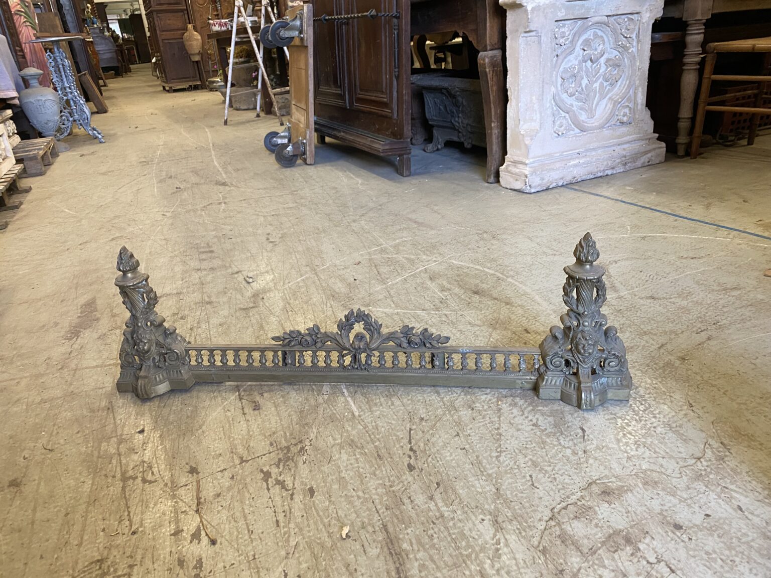 French Iron Dog pretty patterned base with decorative posts on end and Centre piece. C 1870. Town and Country Antiques