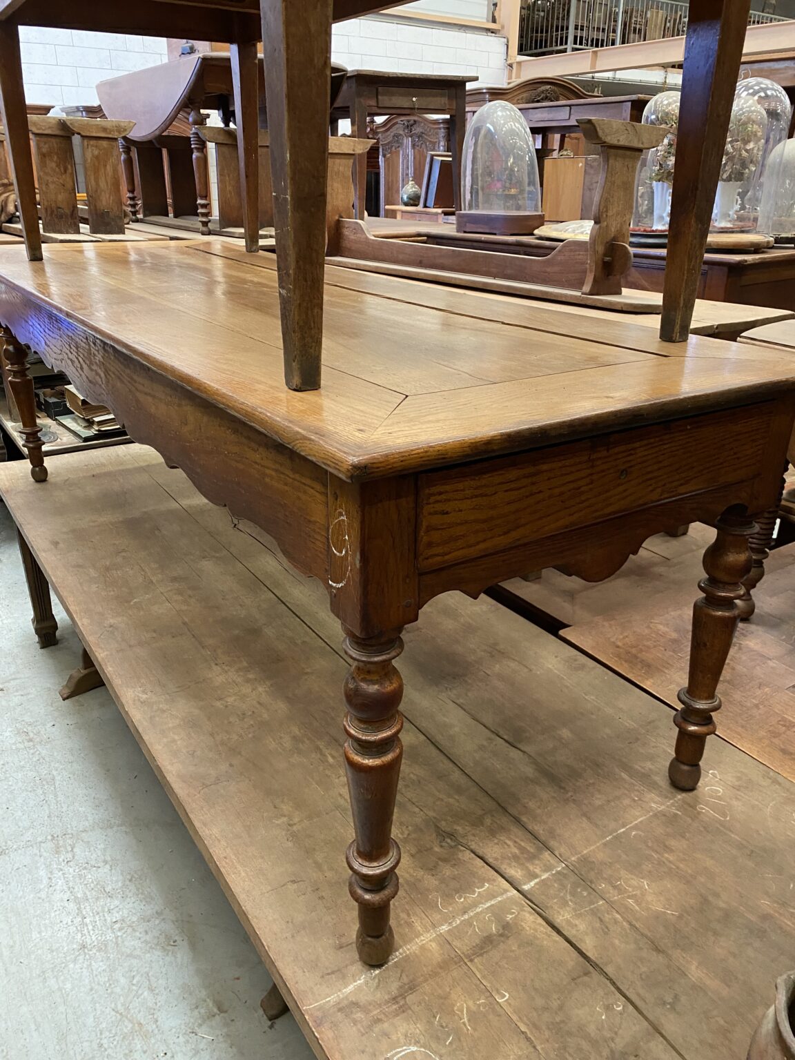 French Oak Provincial Table. Picture frame top with a scalloped apron on turn ed legs. Town and Country Antiques