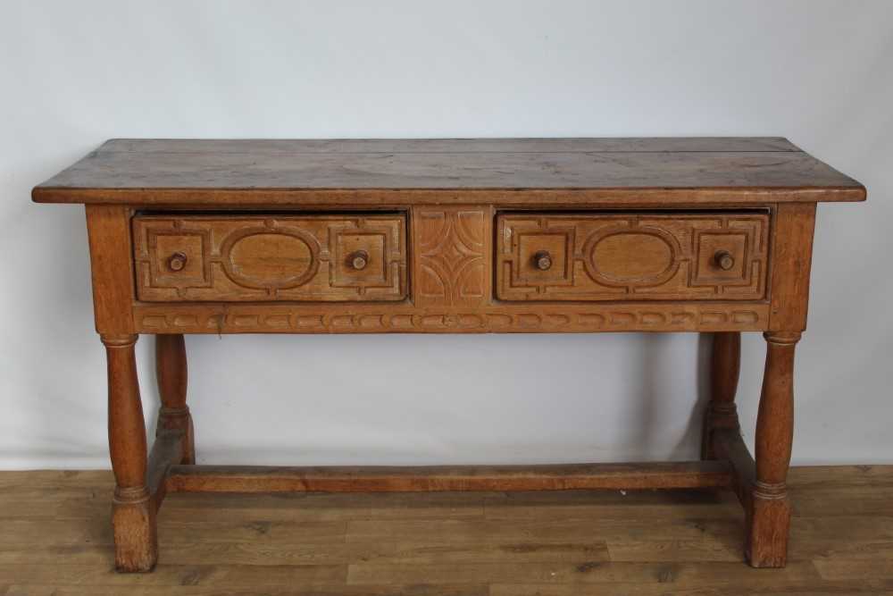 Oak Sideboard carved fronted two Drawers. with turned legs and joined by Stretchers. Town and Country Antiques