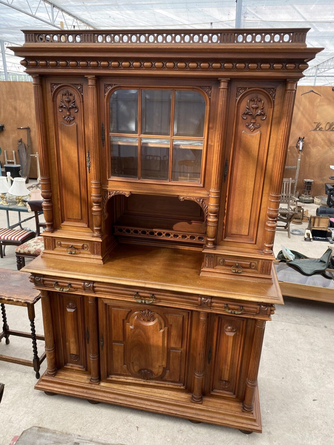 Victorian Walnut Dresser. Columns run from top to bottom. Frieze top with drawers and cupboards. Town and Country Antiques