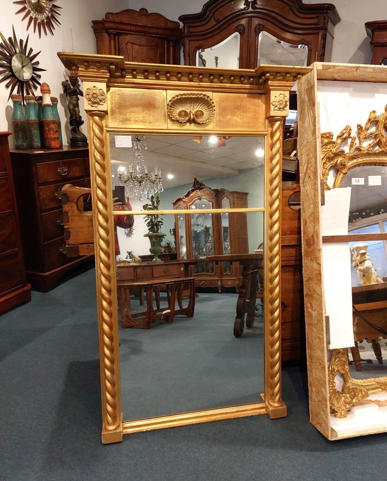Regency Gilt Mirror. Rope design at sides. rosettes and shell shape at top. Town and Country Antiques