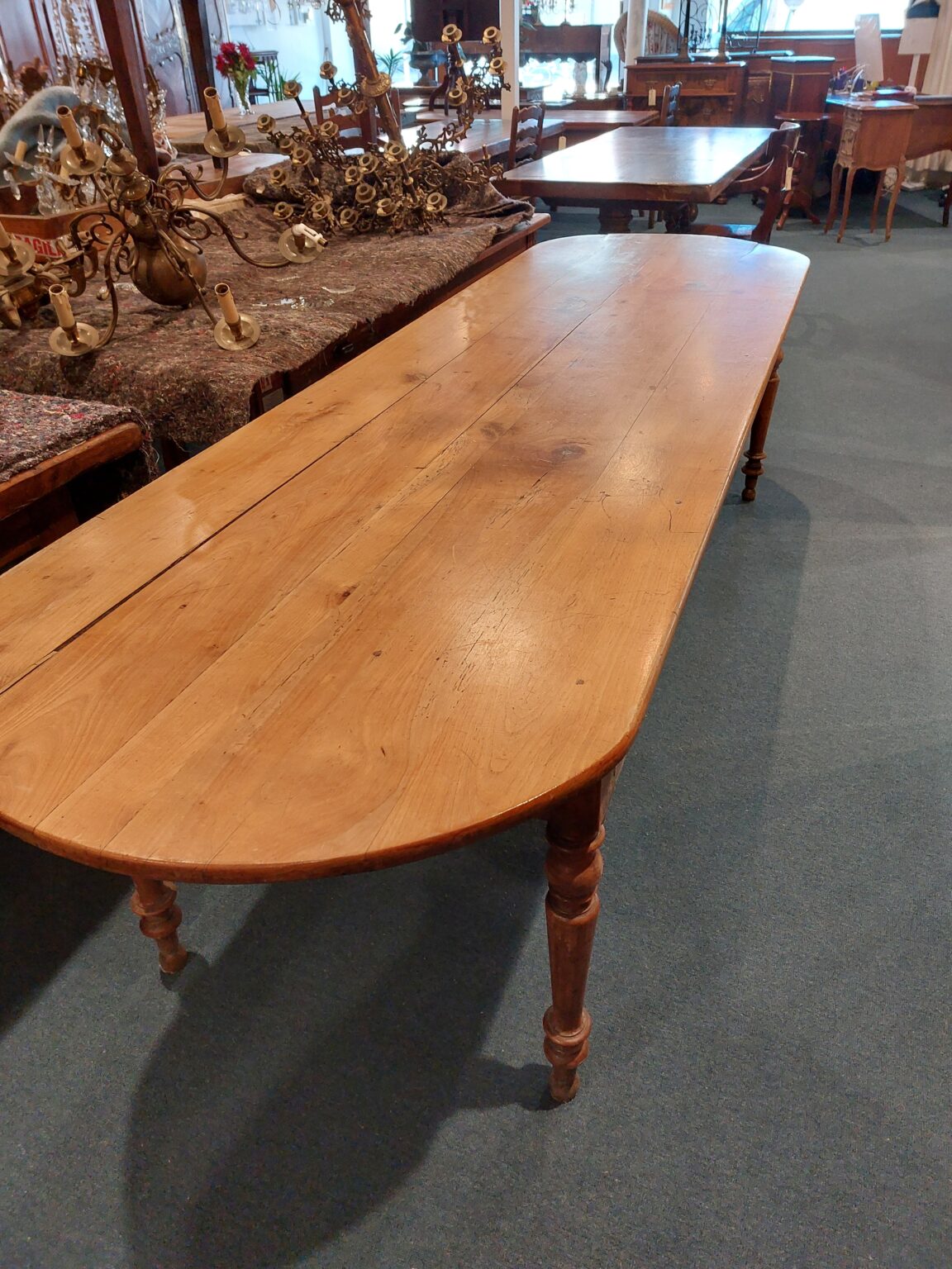 Lovely French Cherrywood round ended table. Turned legs Town and Country Antiques