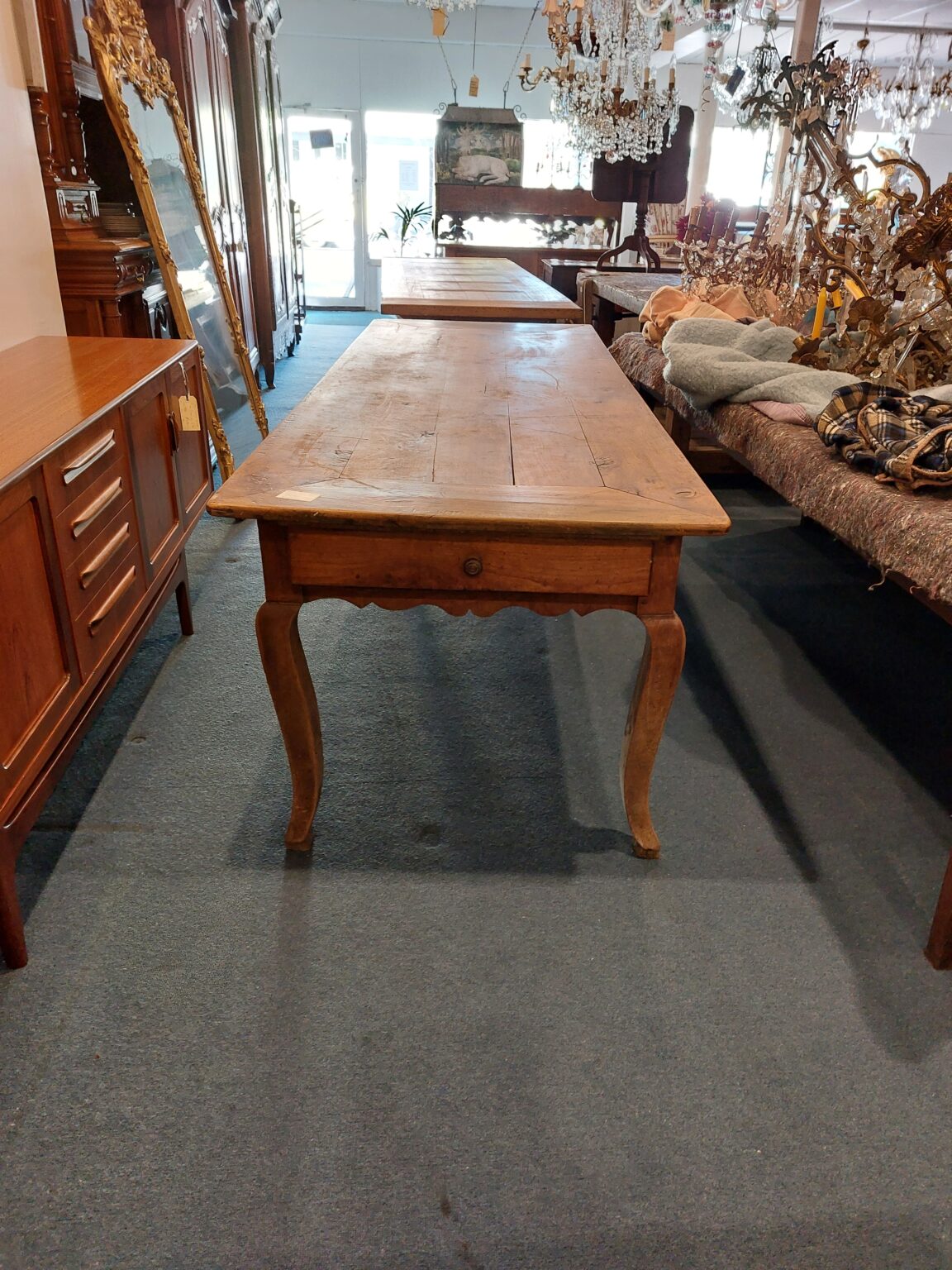 French provincial Table with shaped apron and 3 drawers. In cherrywood. Picture frame top. Town and Country Antiques